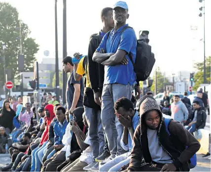  ?? AP ?? Paris evacuated nearly 3000 migrants from a makeshift camp in the French capital yesterday.