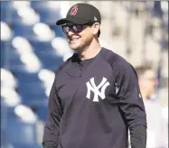  ?? Lynne Sladky / Associated Press ?? Yankees manager Aaron Boone wears a hat honoring the victims of the mass shooting at Marjory Stoneman Douglas High School before an exhibition game against the Detroit Tigers on Feb. 23.