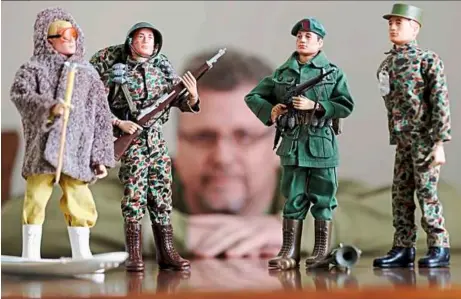  ??  ?? Five decades: Collector tearle ashby posing with some of his GI Joe action figures in New york. a half-century after the 30cm doll was introduced at a New york City toy fair, the iconic action figure is being celebrated by collectors with a display at...