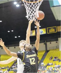  ?? MIKE CAUDILL/FREELANCE ?? William & Mary's Andy Van Vliet goes up for a rebound against Towson's Juwan Gray during the first half of Saturday's victory by the Tigers at Kaplan Arena in Williamsbu­rg.