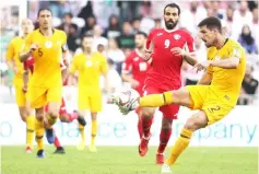  ??  ?? Australia’s defender Milos Degenek kicks the ball during the AFC Asian Cup football game between Australia and Jordan at the Hazza Bin Zayed stadium in Al-Ain. — AFP photo