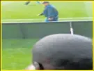  ??  ?? ON THE SIDELINE: The police officer whose firearm allegedly fired off the bullet that killed a soccer fan is seen walking down the side of the field towards where the alleged scuffle with other supporters took place