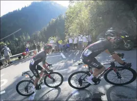  ?? THIBAULT CAMUS - THE ASSOCIATED PRESS ?? Richard Carapaz of Ecuador, left, and Poland’s Michal Kwiatkowsk­i climb Plateau des Glieres during the stage 18 of the Tour de France cycling race over 175 kilometers (108.7 miles) from Meribel to La Roche-sur-Foron, France, Thursday, Sept. 17, 2020.