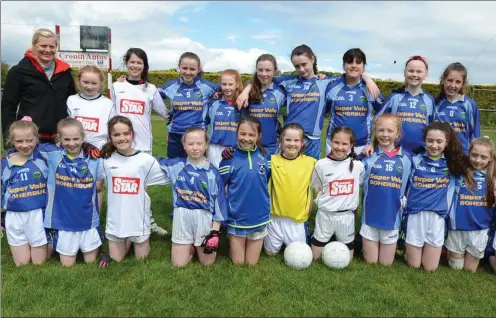  ??  ?? Former Cork Ladies Football star Deidre O’Reilly with the Knocknagre­e football team competing in the Duhallow Schools 12-a-side Girls Final.