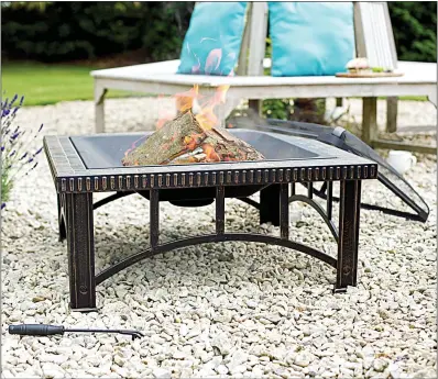  ??  ?? SQUARE DEAL: Big heaters like the Rimini Mosaic fire pit give out warmth over a wide area