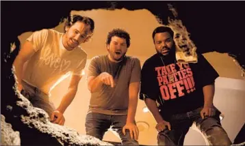  ?? Suzanne Hanover
Columbia Pictures ?? THE POPULAR stars in the apocalypse comedy “This Is the End” play skewed versions of themselves, but it’s James Franco — shown with Danny McBride, center, and Craig Robinson — who does it with meta-f lair.
