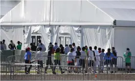  ??  ?? Children line up to enter a tent at the Homestead shelter for unaccompan­ied children in Homestead, Florida in February 2019. Photograph: Wilfredo Lee/AP