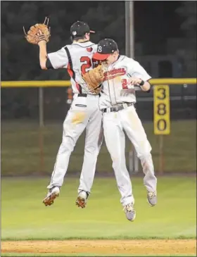  ?? SAM STEWART - DIGITAL FIRST MEDIA ?? Boyertown’s Mike Raineri (2) and Quinn Mason (22) celebrate after the Bears defeated Pope John Paul II 7-3 Friday night.