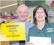  ?? 220218morr­isons_05 ?? Generous Morrisons manager Jim with customer service assistant Ann Seagriff