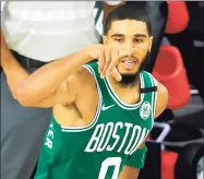  ?? Kevin C. Cox / Getty Images ?? The Celtics’ Jayson Tatum celebrates a 3-pointer against the 76ers during the third quarter on Wednesday.