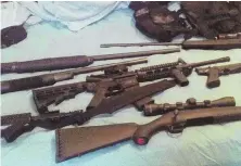  ?? AP PHOTO ?? STOCKING UP: This photo posted on the Instagram account of Nikolas Cruz shows weapons lying on a bed. Cruz is charged with Wednesday’s school massacre.