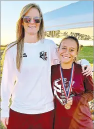  ?? SUBMITTED ?? Gentry girls’ coach Jamie Johnson (left) poses with Gentry sophomore Morgan Polina, who placed 10th and medaled in the 500-meter run at the Huntsville District 4-A meet on Oct. 26 with a time of 23:40.03. She also achieved a new personal record. Gentry’s Jakob Cox placed 20th at the meet with a time of 20:04.35.