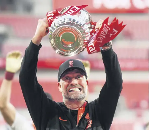  ?? ?? Liverpool manager Juergen Klopp celebrates with the FA Cup trophy, London, England, May 14, 2022.