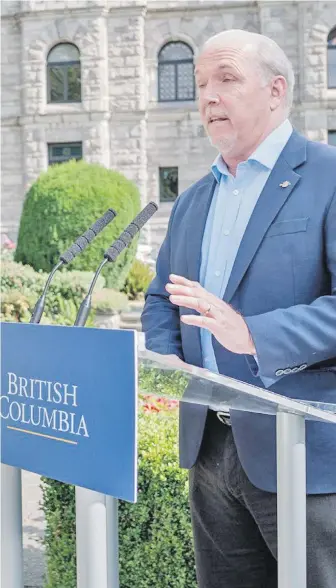  ??  ?? Premier John Horgan at the legislatur­e on Thursday. “We’re only going to be able to defeat this if we do it together. The challenge ahead of us is enormous.”