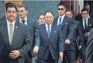  ?? AP ?? North Korea’s Kim Yong-chol, centre, leaves a hotel in New York on Wednesday. The senior North Korean official has arrived in New York in the highest-level official visit to the United States in 18 years, as President Donald Trump and Kim Jong-un...