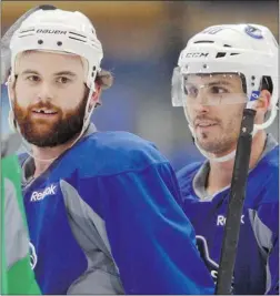  ?? ARLEN REDEKOP/ PNG ?? Rookie Zack Kassian, left, will be battling for a wing position on the Canucks’ fourth line while Max Lapierre, right, will be on the third.