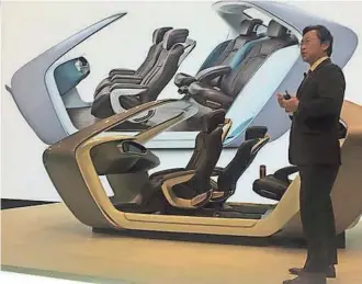 ?? J.C. REINDL / DETROIT FREE PRESS ?? Richard Chung, Adient's vice president of innovation, describes the AI17 seating system for self-driving cars at the North American Internatio­nal Auto Show in Detroit. The luxury seats feature a deep recline.