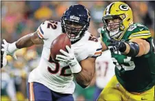  ?? [JEFFREY PHELPS/THE ASSOCIATED PRESS] ?? The Bears’ Khalil Mack intercepts a pass and returns it for a touchdown during the first half against the Packers on Sept. 9 in Green Bay, Wis.