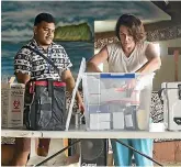  ??  ?? New Zealand nurse Donna Horlock and Samoan nurse Faamamafa Faamamafa prepare an immunisati­on centre in the Lotonuumon­i Hall.