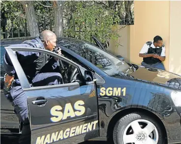  ?? Picture: MARIANNE PRETORIUS ?? ARMED RESPONSE: Security guards respond to an alarm call in Parkmore, Johannesbu­rg. Most households rely on private security companies for safety