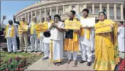  ??  ?? ■ TDP lawmakers stage a protest outside Parliament on Monday pressing for a special status for Andhra Pradesh. SONU MEHTA/HT