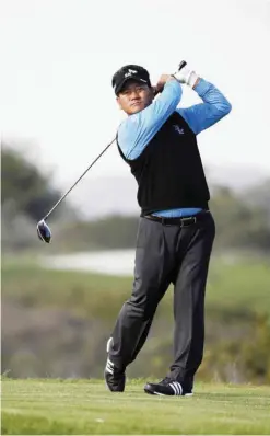  ??  ?? SAN DIEGO: K.J. Choi of South Korea tees off on the 9th hole during Round 2 of the Farmers Insurance Open at Torrey Pines North on Friday in San Diego, California. — AFP