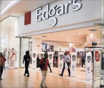  ?? PHOTO: REUTERS ?? An Edgars store at a shopping centre in Soweto. The retail chain’s Zimbabwe unit says it may have to turn to South African parent Edcon for merchandis­ing support as it loses market share to informal traders who are importing second-hand clothing...