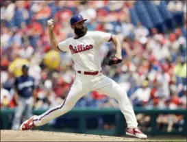  ?? MATT SLOCUM — THE ASSOCIATED PRESS ?? Philadelph­ia Phillies’ Jake Arrieta pitches during the second inning of a baseball game against the Milwaukee Brewers, Saturday in Philadelph­ia.