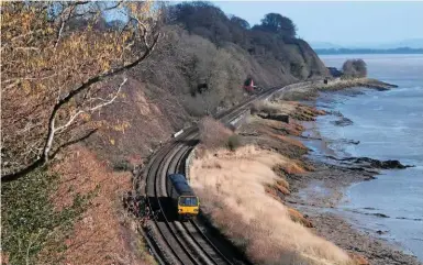  ?? PAUL SHANNON. ?? Arriva Trains Wales 143614 passes Gatcombe (between Gloucester and Newport) on February 15. The Welsh Government’s bid for powers to award and manage the new Wales & Borders franchise has moved closer, with the laying of a draft order in front of...