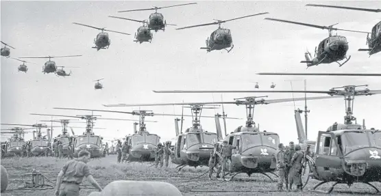  ?? | HENRI HUET/ AP ?? U. S. Army helicopter­s provide support for U. S. ground troops 50 miles northeast of Saigon, South Vietnam, in 1966.