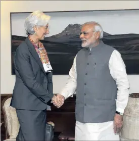  ?? PHOTO: REUTERS ?? Internatio­nal Monetary Fund managing director Christine Lagarde (left) meets India’s Prime Minister Narendra Modi on Monday. She has warned of capital swings in markets.