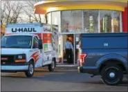  ?? MARIAN DENNIS — DIGITAL FIRST MEDIA ?? Police filled a U-Haul truck with more than 200 items as they executed a search warrant at Capitol Cash Exchange in West Pottsgrove.