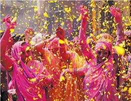  ?? — G. N. JHA ?? Widows participat­e in Holi celebratio­ns at the ancient Gopinath Temple in Vrindavan on Tuesday.