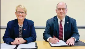  ?? COURTESY OF RACC ?? Dr. Susan Looney, Reading Area Community College president, and Dr. Kenneth Hawkinson, Kutztown University President, have signed a dual admissions agreement.
