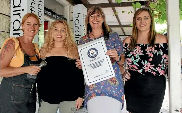  ??  ?? Kerikeri hairdresse­rs Laurel Stratford, Meredith Simpson, Sharon Sanderson and Stacey McLean with the Guinness World Record certificat­e.