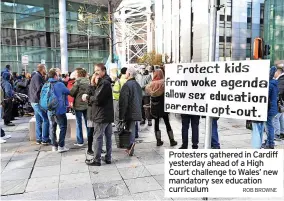  ?? ROB BROWNE ?? Protesters gathered in Cardiff yesterday ahead of a High Court challenge to Wales’ new mandatory sex education curriculum