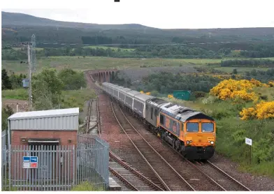  ?? GRAEME ELGAR. ?? Above: On June 28, GBRf 66736 Wolverhamp­tonWandere­rs leads 73968 on the 2116 London Euston-Inverness through Culloden. GBRf is supplying a ‘66/7’ for Caledonian Sleeper trains until sufficient ‘73/9s’ are available. It no longer hires Class 67s from DB...