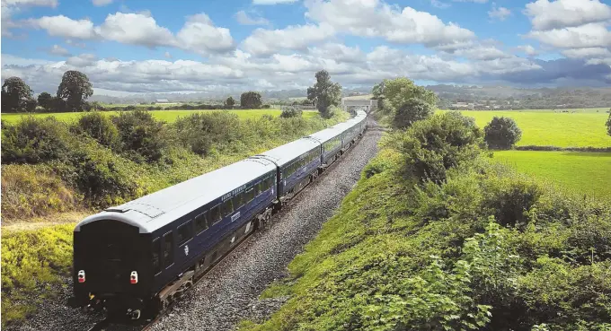  ?? TNS PHOTOS ?? LUXURY LINER: The Belmond Grand Hibernian takes travelers across Ireland in comfort. The bar car, below, is a popular place for passengers to gather.