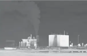  ?? NEW YORK TIMES FILE PHOTO ?? An infrared image shows an emissions leak at and MDC Energy site in Texas last year. Oil and gas companies are hurtling toward bankruptcy, raising fears that wells will be left leaking planet-warming pollutants, with cleanup cost left to taxpayers.