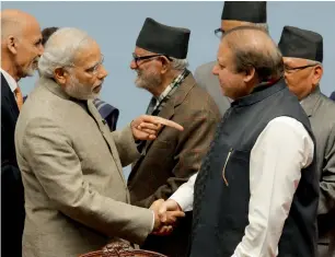  ?? AFP file ?? Indian Prime Minister Narendra Modi shakes hands with Prime Minister Nawaz Sharif during the closing session of the 18th Saarc summit at City Hall in the Nepalese capital Kathmandu in 2014. —