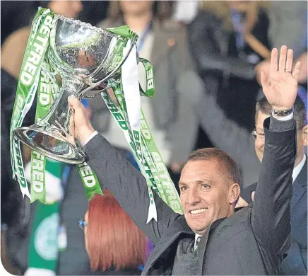 ??  ?? Brendan Rodgers lifted the Betfred League Cup last Sunday, his fourth consecutiv­e domestic trophy at Celtic