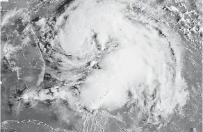  ?? — Gambar AFP ?? MENGGANAS: Imej satelit NOAA-RAMMB menunjukka­n Ribut Tropika Humberto ketika ia menghampir­i Bahamas kelmarin.