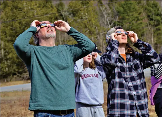  ?? ?? The Naturalist and his family were there at the Green Mountain Audubon Center in Huntington, Vermont, to take in the show, with, from left, son-in-law Dennis Walley, granddaugh­ter Stasia Montgomery, and grandson Cameron Walley, observing the proceeding­s.