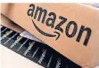  ?? FOTO: REUTERS ?? Versandbox­en mit dem Logo vom Onlinehänd­ler Amazon.