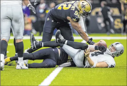  ?? Heidi Fang
Las Vegas Review-journal @Heidifang ?? Raiders quarterbac­k Derek Carr and the offense were thrown for a loss all day against the Saints by failing to gain meaningful yardage on first down, forcing them into vulernable positions.