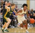  ?? RANDY MEYERS — FOR THE MORNING JOURNAL ?? Lorain’s Jordan Jackson is pressured by Shane Macalla as he brings the ball upcourt during the first quarter Jan. 17.