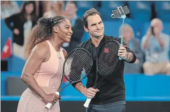  ?? PAUL KANE
GETTY IMAGES ?? Serena Williams and Roger Federer take a selfie on court following their mixed doubles match at the 2019 Hopman Cup at RAC Arena Jan. 1 in Perth, Australia.