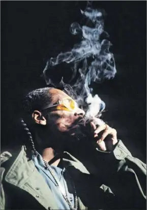  ?? ?? Put that in your pipe and smoke it: Snoop Dogg (above) and Peter Tosh (below) get their inspiratio­n from on high. Photos: Gie Knaeps/getty Images & Richard E Aaron/redferns/getty Images