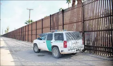  ?? Sandy Huffaker AFP/Getty Images ?? THE BORDER PATROL is replacing about two miles of 1990s barriers in Calexico with a 30-foot-high structure at a cost of about $18 million. Project planning began in 2009, long before Donald Trump ran for president.