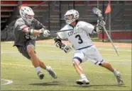  ?? GENE WALSH — DIGITAL FIRST MEDIA ?? La Salle’s Matthew Clibanoff races up field as Conestoga’s Jackson Niness defends Monday at Owen J. Roberts.